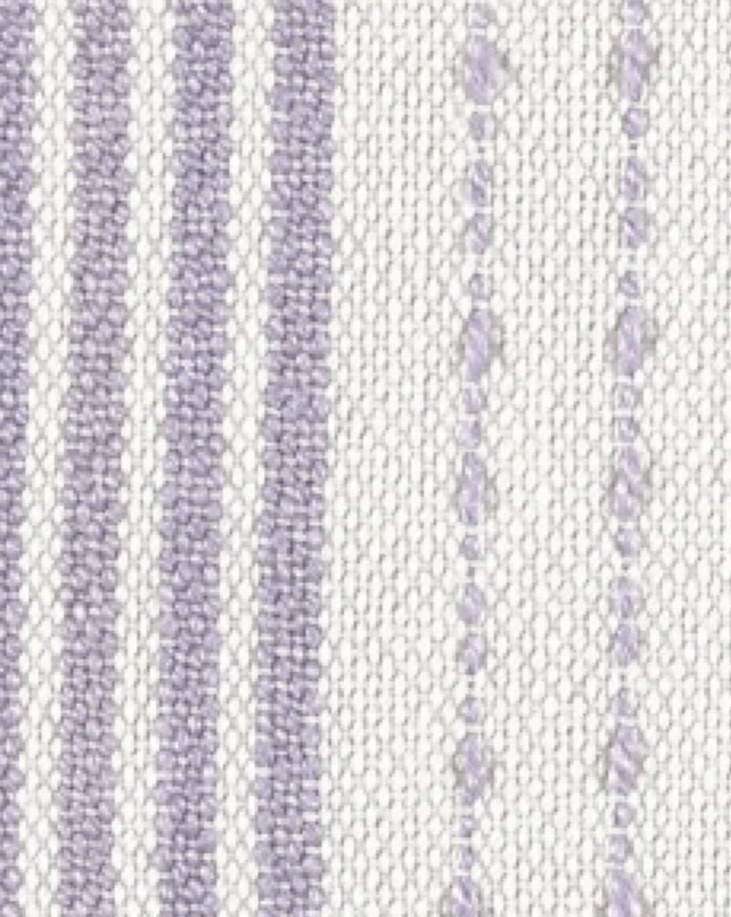 Close up of weaved white cloth with purple vertical lines